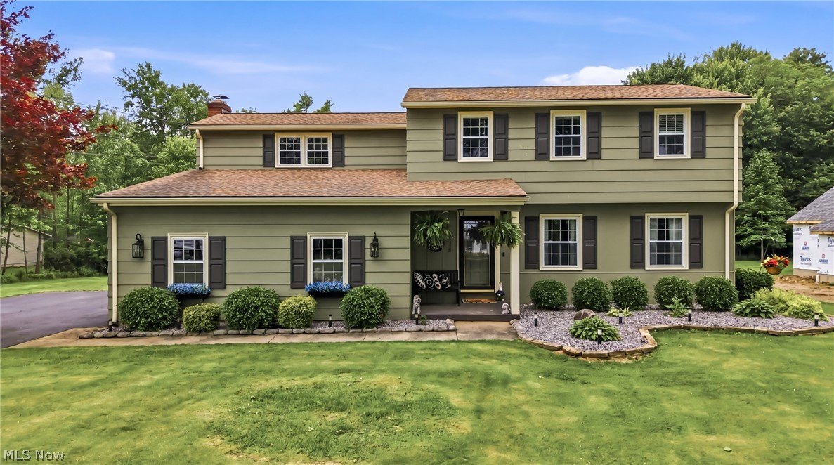 Located in "Paradise"- This Canfield colonial in the highly desirable South Range School District delivers all that- and then some! Set on nearly 1.5 acres, this 4-bedroom, 3-bath beauty with 2188 square feet checks ALL the boxes. The show-stopping family room features a soaring cathedral ceiling, cozy fireplace, and plenty of room for special occasions and everyday living. The updated eat-in kitchen has granite countertops, newer stainless steel appliances, and easy access to the massive concrete back patio with built-in seating- perfect for summer cookouts. The main level also offers an oversized living room and formal dining room with gorgeous engineered hardwood floors, plus a convenient half bath. Upstairs, you’ll find four generously sized bedrooms, including a spacious primary suite with tons of storage and a freshly renovated full bath completed in 2026. Another full bath rounds out the second floor. The basement provides a laundry area, lots or storage and a finished area for a great workout area or rec room. Outside, the private backyard is perfect for relaxing or entertaining- complete with a large shed, wooded surroundings, and room to spread out and enjoy. Many updates are already done for you, including a new septic system and electric panel (2023), sump pump (2026), and fresh low maintenance landscaping with beautiful Canadian bluestone (2025). Attached 2-car garage and USDA loan eligibility make this one even sweeter. Enjoy the perfect balance of peaceful country living and convenient access to everyday amenities. Homes with this much space, personality, and privacy in this location don’t come around often- don’t miss your chance to make it yours!