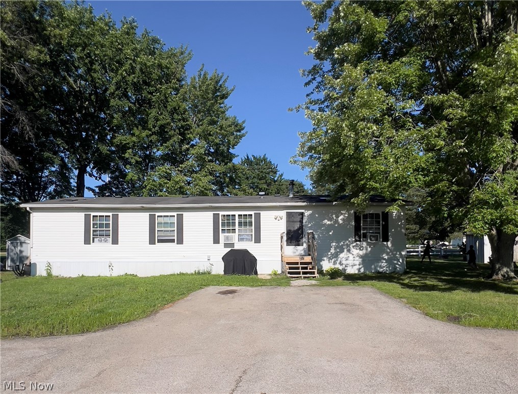 Beautifully maintained 4-bedroom, 2-bathroom home in the sought-after AUSTIN WOODS COMMUNITY of Geneva Twp, located in the award-winning wineries, shopping, dining, and parks! Featuring a move-in-ready open and inviting floor plan that offers 1,568 square feet of space and flexibility today's buyers are looking for. The spacious living room flows seamlessly into the large eat-in kitchen, complete with abundant cabinetry, generous counter space, and room to gather with family and friends. The private owner's suite includes a full bath and ample closet space, while three additional bedrooms provide options for guests, a home office, playroom, etc. Natural light fills the home, creating a warm and welcoming atmosphere throughout. This home is one of the popular Skyline models, equipped with some updates completed in 2024, such as LTV flooring throughout and paint, wood accent walls, toilets, and plumbing. Block foundation, tie downs, vapor barrier, and skirt were replaced in 2024. H20 tank and gas furnace were updated in 2022. Schedule your private showing today and experience why buyers choose Geneva Twp and Austin Woods Community as their place to call home.