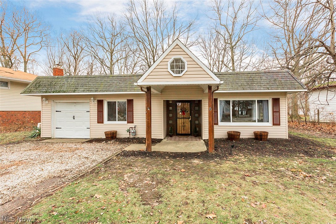 Enjoy lake views and picturesque sunsets from the living room of this 3 bedroom, 2 bath ranch located in beautiful Timberlake! This mid century modern home has been freshly painted throughout every room and has had many updates including air conditioning, installed 6-2019, new hot water tank 2017, new carpet 5-2019, brand new microwave, new electrical outlets throughout, and new tub surround 2019, among other updates. The third bedroom is currently being used as an office but can easily be converted back into a bedroom. One year home warranty included! Take advantage of Timberlakes park and beautiful private beach access and schedule your private showing today