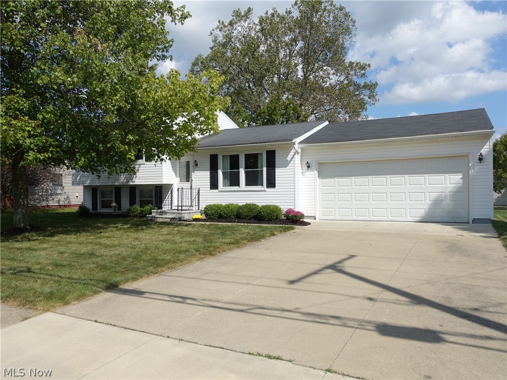 Looking for 1st floor living and a well loved/maintained home?  This is it!  Larger than it looks split offering a huge addition with 1st floor master, full bath with walk in shower, large entry off the garage is perfect for a large "drop zone"/mud room with sliders to a nice deck.  The spacious living room is open to very nice eat in kitchen with plenty of cabinet and counter space (appliances convey).  The 2nd floor features 3 more bedrooms with nice closet space and full bath.  The lower level offers a nice recreation room and office with walk out.  Attached 2 car garage currently has a ramp into the home.   Furnace/AC 2015 and newer windows.  The backyard is level and is fenced in.  Home warranty offered for peace of mind.