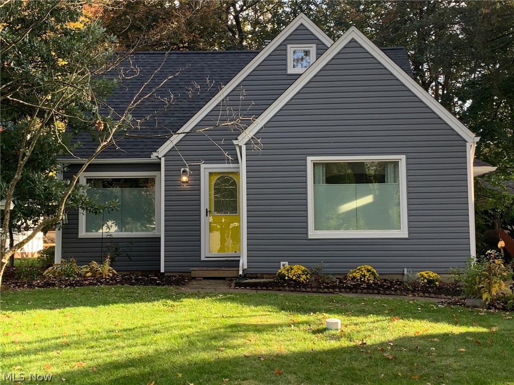Welcome home to this beautifully updated, move in ready Cape with room to grow in the charming coveted West Akron community of Castle Park. Located just a short walk from Stan Hywet Hall and close to shopping, restaurants & parks, there is plenty of activity to be enjoyed year-round! The first floor boasts plenty of living space, & an abundance of natural light! Beautiful wood flooring flows through the open floor plan & into the living room where you'll find the cozy fireplace & relaxing atmosphere.  The second story offers the spacious Master Bedroom with walk in closets and plenty of room to easily ad a Master Bath en-suite. The basement has been partially finished for recreation including a second fireplace for those chilly fall nights. The lover level boasts a great workshop space as well as additional storage & shelving. The private backyard is definitely a bonus. Other home improvements include: brand new roof, new siding, new gutters (10/2020), new windows with exception of a f