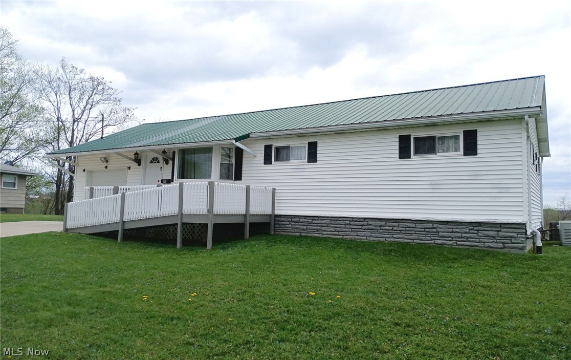 Very nice, traditional ranch in a semi-rural area. Great living space that includes a family room, 3 bedrooms, 1 bath and a spacious living room. At the back of the house is a large covered deck that has a spectacular view overlooking the hills of West Virginia. Easy maintenance and upkeep. Generac whole house generator.

There is a Ring security system on the property securing all doors and windows. (Does not convey).

There is a gas fired, Generac generator with the house.