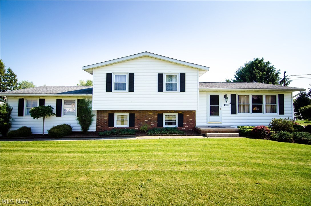 Attractive,spacious, updated 4 level split! Great natural lighting in the large living room.  The dining room has newer beautiful glass doors to the covered deck area.  You will love this open U shaped kitchen with granite counter tops, maple cabinets, and two "Super Susans"! The eat in granite bar opens to the dining room that offers an excellent serving stage for those family events and holidays! The kitchen and dining room have newer high end laminate flooring and updated appliances. The newer large French door refrigerator with drawer freezer, has in door water and ice, with child lockout controls and open door alarms. Upstairs are three bedrooms,with newer carpeting through out. The master bedroom has an updated master bath and his and her closets.  The main bath and half bath have also been updated! The lower level half bath has lots of storage!  Love the easy access from the side load  2.5 car garage, to a great mud room area.  Plenty of storage here, perfect for removing muddy