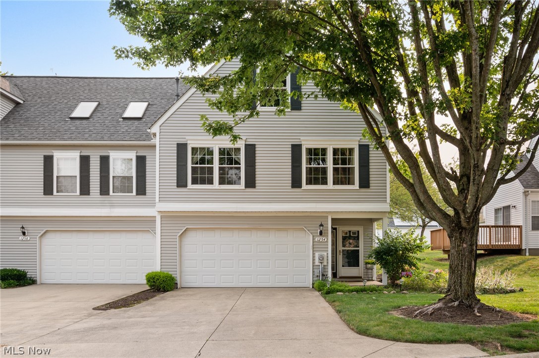 Welcome home to this exceptionally maintained, beautifully modernized townhome that’s truly move-in ready! Featuring numerous updates throughout, this home offers stylish finishes, a functional layout, and low-maintenance living in an unbeatable Tallmadge location.

Step through the front door into a welcoming foyer where you’ll find the first bedroom and a conveniently attached laundry room. Upstairs, the spacious main living level features a bright kitchen, dining area, comfortable living room, full bathroom, and a versatile office that’s perfect for working from home, studying, or additional living space. The upper level offers a private primary bedroom, an additional bedroom, and a second full bathroom.

Outdoor enthusiasts will love being directly across the street from a beautiful Metro Park with scenic trails for hiking, walking, and enjoying nature. Shopping, dining, and everyday conveniences are all within walking distance. Located in the highly rated Tallmadge School District, this home also benefits from school bus service.

Whether you’re a first-time buyer, downsizing, or simply looking for a home that’s been meticulously cared for, this one checks all the boxes. Just unpack and start enjoying everything this wonderful home and location have to offer!
