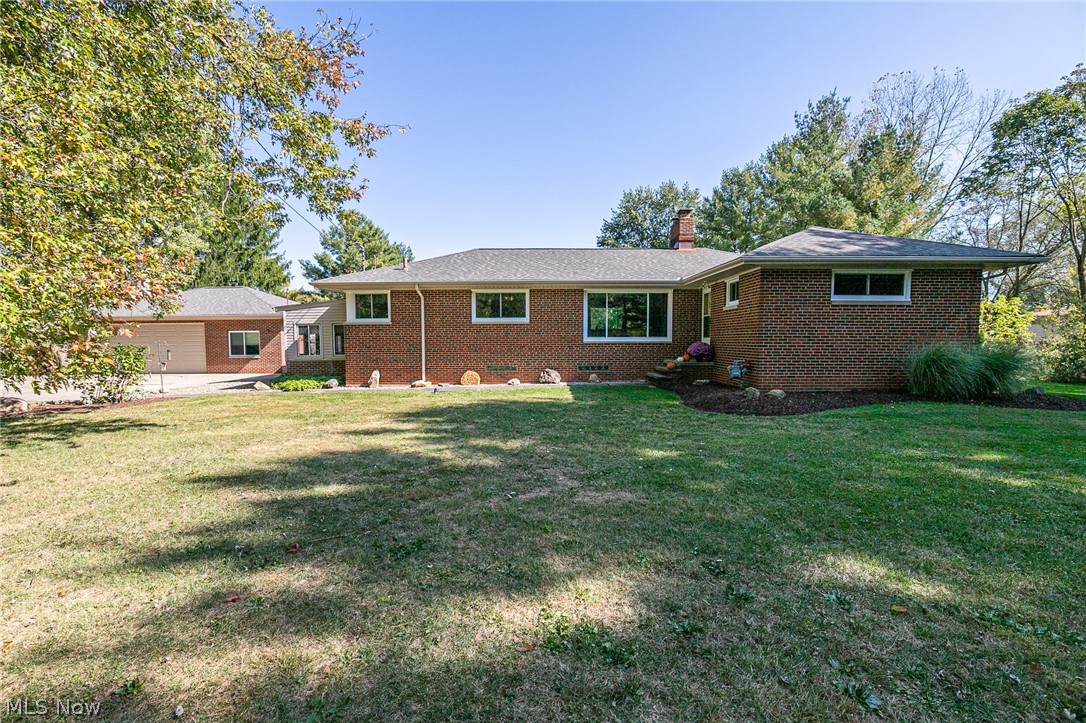 This move-in ready brick ranch is a must see! Nestled on 2.68 acres, it has all the privacy anyone could ask for. This house features 3 bedrooms, 1.5 baths with an open concept and a full basement. 2 HUGE picture windows allow an abundance of natural light to fill the house. Dining room is open to both the kitchen and the family room. With 2 wood burning fireplaces, you will always have a cozy place to warm yourself during the winter months. The spacious eat in kitchen boasts new granite countertops, sink and backsplash. Partially finished basement, complete with new glass block windows has a dog shower, hang out area and tons of storage space. Outside you find a three and half car garage with electric, a newer garage door and a man door for easy access. The 16x23 barn has a concrete floor, loft and electric as well. The 11x14 shed provides for even more storage needs. Tons of updates, including a tankless hot water heater, and newer windows with transferable warranty. Plus, all applia