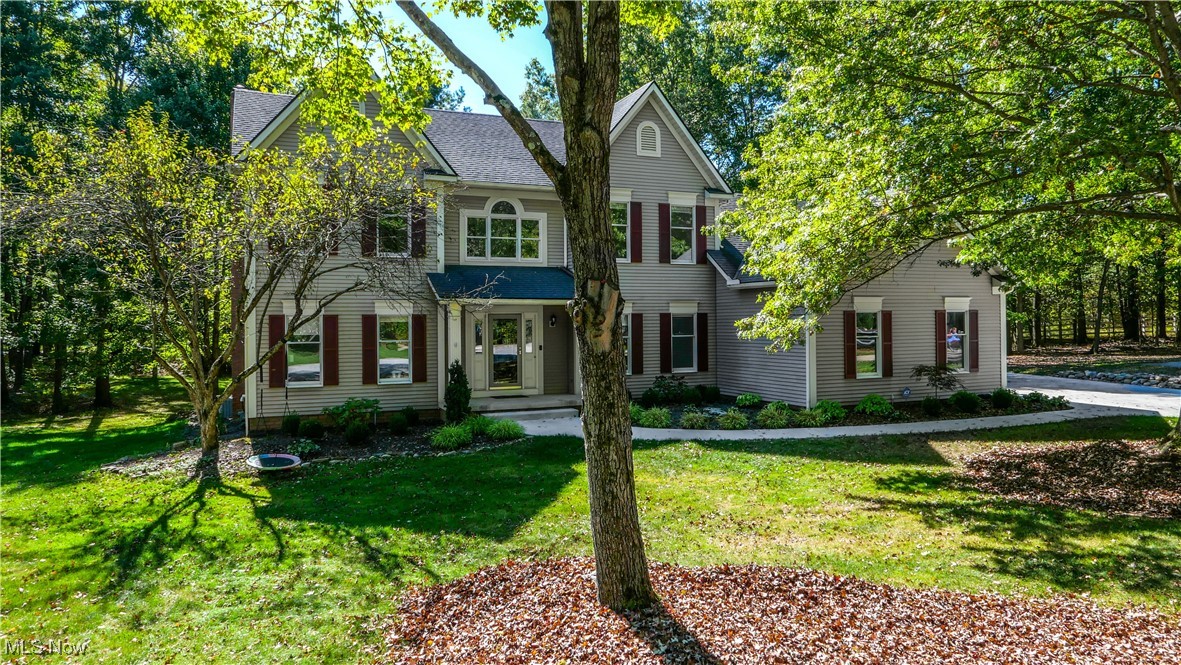This classic 4-bedroom, 3-bath colonial sits at the end of a quiet cul-de-sac in Hudson’s desirable Bridgewater Place. A soaring, light-filled foyer sets the tone for the home’s open and comfortable layout. On the main level you’ll find a flexible living room or office, an elegant dining room for gatherings, and a welcoming family room highlighted by wood ceiling beams and a gas fireplace. The kitchen features granite counters, stainless steel appliances, a walk-in pantry and sunny dinette, while a convenient half bath and laundry room complete the first floor. A bright sunroom off the kitchen steps out to the rear deck and backyard. Upstairs, the owner’s suite offers a walk-in closet and private bath with a garden tub. Three additional bedrooms, each with custom closet systems, share a full hall bath. The spacious three-car garage provides room for vehicles, hobbies and storage. Recent updates include a new furnace, hot water tank, carpet, interior paint, interior doors refinished, driveway, landscaping, kitchen refrigerator, updated closets and even a basketball hoop. Sellers are offering an allowance for hardwood flooring refinishing with an acceptable offer. A home warranty is included. Offering a combination of comfort, updates, and location, this home is ready for you to make it your own.