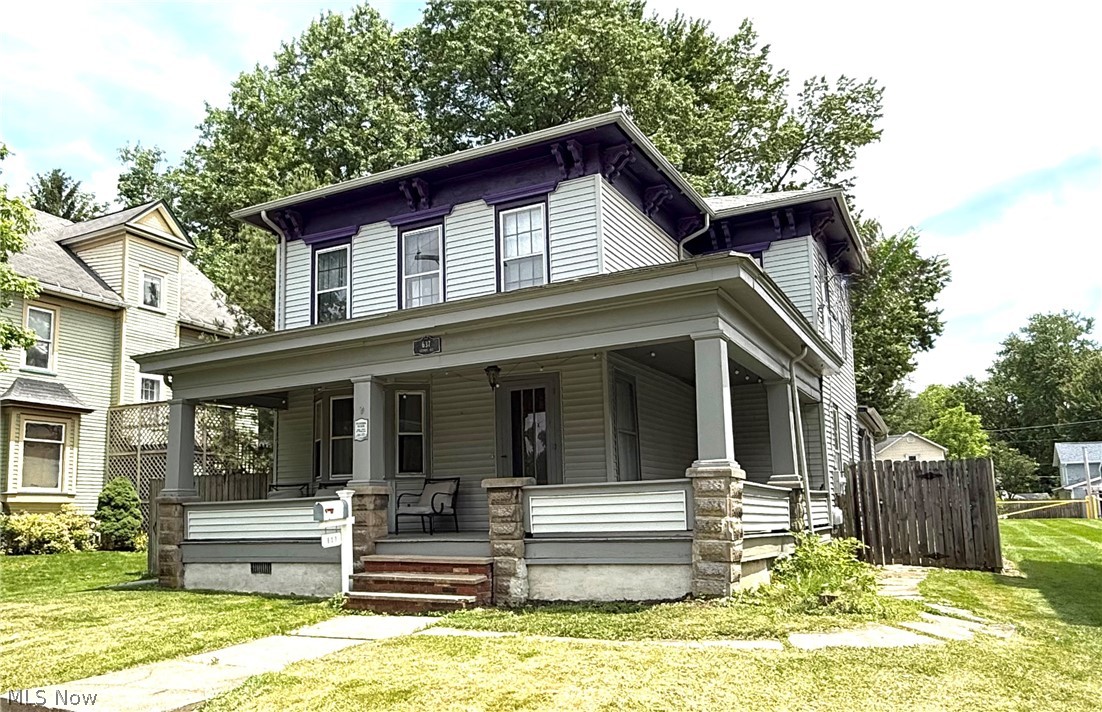 Welcome home to this charming 3 bedroom, 2 bath Colonial in the heart of historic Wooster! Full of character and timeless appeal, this home blends modern updates with original architectural details to create the perfect modern farmhouse feel. Inside, you’ll find a thoughtfully updated interior featuring LVP flooring, an updated kitchen, new appliances, and updated bathrooms, all while preserving the home’s historic charm. Original wide-plank hardwood floors, a beautiful hand-turned, curved baluster staircase, and classic details found throughout add warmth and character. The main floor offers a spacious formal dining room, convenient first-floor laundry, and a practical mudroom that helps keep everyday life organized. Upstairs, generously sized bedrooms provide comfortable living space and ample room for furniture, storage, a home office or game room. The basement is typical for a home of this era and has been improved with a new sump pump and drainage system. This solid, well-built home has the good bones you are looking for PLUS the added peace of mind of a one-year America’s Preferred Home Warranty!
The backyard is fully enclosed with a privacy fence, creating a great space for entertaining, gardening, pets, or simply enjoying the outdoors....and the inviting wraparound front porch is sure to become your favorite place to unwind! Whether you’re enjoying your morning coffee, watching the seasons change, or relaxing with friends on a warm summer evening, the spacious porch offers the perfect spot to slow down and enjoy small-town living! Located near downtown Wooster and just across the street from the elementary school, this home offers easy access to local shops, restaurants, parks, and community events while maintaining a welcoming neighborhood feel. If you’ve been searching for a home with character, charm, modern updates, and a fantastic location, this beautiful Colonial is ready to welcome you home! Call agent to schedule your showing today!
