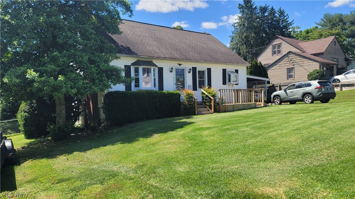 Quiet street in Devola ready for a little loving. Estate sale. 2 bedrooms on main floor, 1 upstairs with office area. Full walkout basement. Open kitchen into living room. New deck in the front. Covered entry on side. Large 1 car garage. Large carport. Nice size fenced in yard.