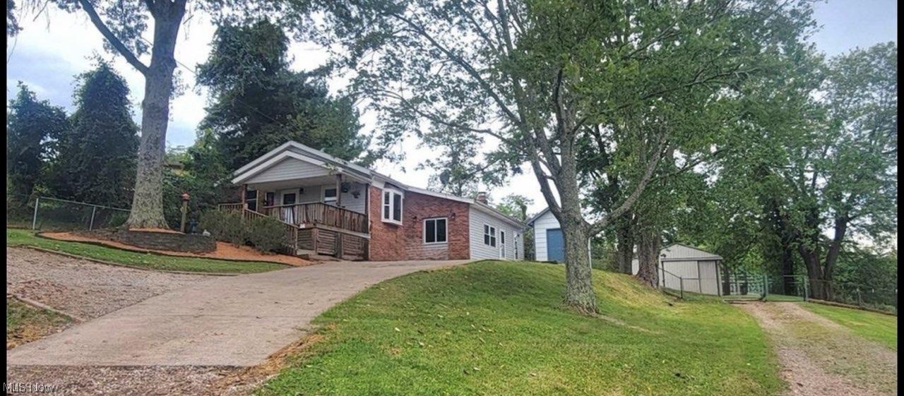 This 10-acre property a hop and skip to Belpre and minutes from Parkersburg. On the front of the home is a large porch with lots of shade from the surrounding trees. From the porch you go into the bright and airy living room with a bay window with a great view
A step up is the eat in kitchen that is been updated with newer maple cabinets, granite countertop, stainless steel appliances, oak trim. Also, there is a pantry in the kitchen. Off the living room is 3 bedrooms, an updated bathroom with sky light and jacuzzi tub, small room with the furnace, water softener and the current owners use it for an office space. Stepping down a few steps from the living room is a cozy family room with a wood stove with natural light coming in, also a room for the washer, dryer and hot water tank. Moving outside there is a small storage shed, fenced in big back yard. 30x40 pole building that does have some fencing for the animals. There is some pasture for the animals and woods for the hunters. There is 600 ft of road frontage. If you're wanting to be close to the amenities but want a country setting this is the place for you 
Make offer!!! Sellers are motivated to sale!!!