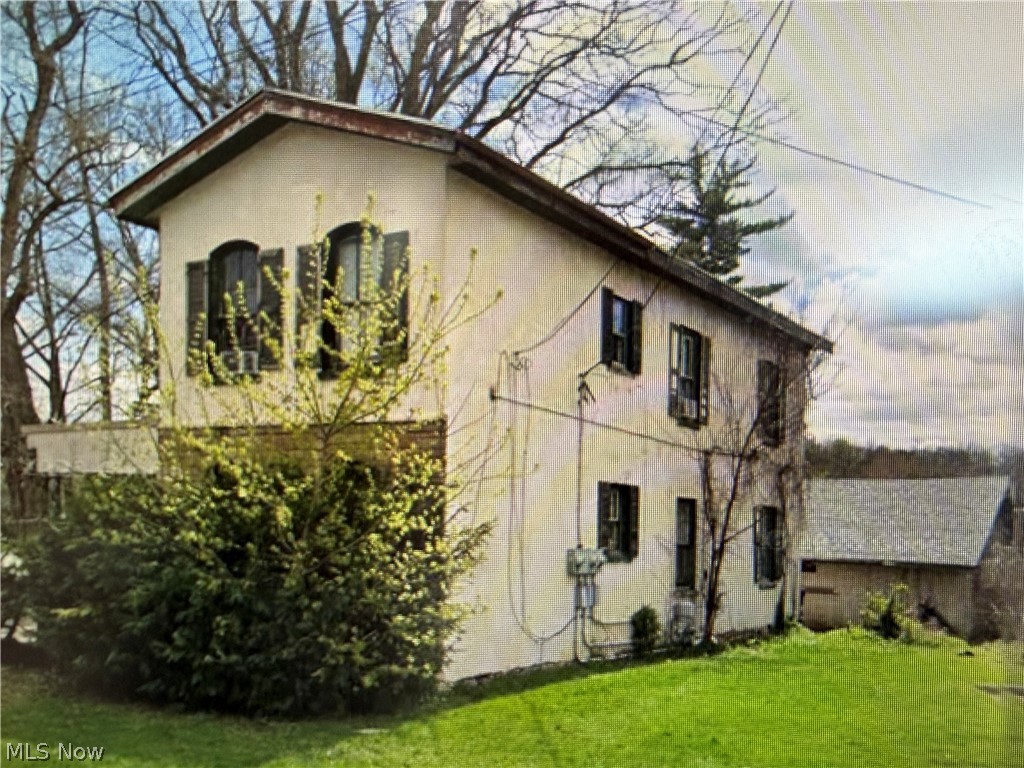 Investors Alert! Investment Property-Duplex-Needs your TLC! 2 units-One up-1BR, 1 bath. One on Main Floor-2BR,1 bath, 2 car detached garage, 2 lots.