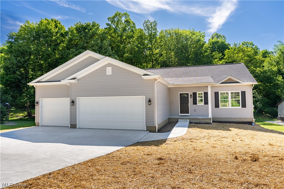 Welcome to this new build ranch-style home! This move-in-ready gem offers 1,232sq. ft. of bright and thoughtfully designed living space with a fresh modern color palette throughout. Step inside from the inviting covered front porch and you’re welcomed by an open floor plan that perfectly blends style and comfort. The heart of the home is the open-concept kitchen, complete with a sleek island and breakfast bar, crisp white cabinetry with black pendant lights, quartz countertops, stainless steel appliances, and a dining area with access to the second story deck, ideal for relaxing or entertaining outdoors. The great room is filled with natural light, features a gas fireplace, and has airy vaulted ceilings, creating the perfect gathering space. Off the great room, are 3 bedrooms and 2 full baths including the master suite. The private master suite boasts a walk-in closet and a full bath with a storage vanity, a linen closet, and a standing shower. A functional laundry room with a wash sink, cabinet space, and a coat closet connects to the attached 3-car garage with heating for added convenience. The full unfinished basement offers abundant storage and potential for additional living space with walk-out to the backyard and plumbing in place for a full bathroom. Don’t miss your chance to call this stunning home your own. Schedule your private showing today!
