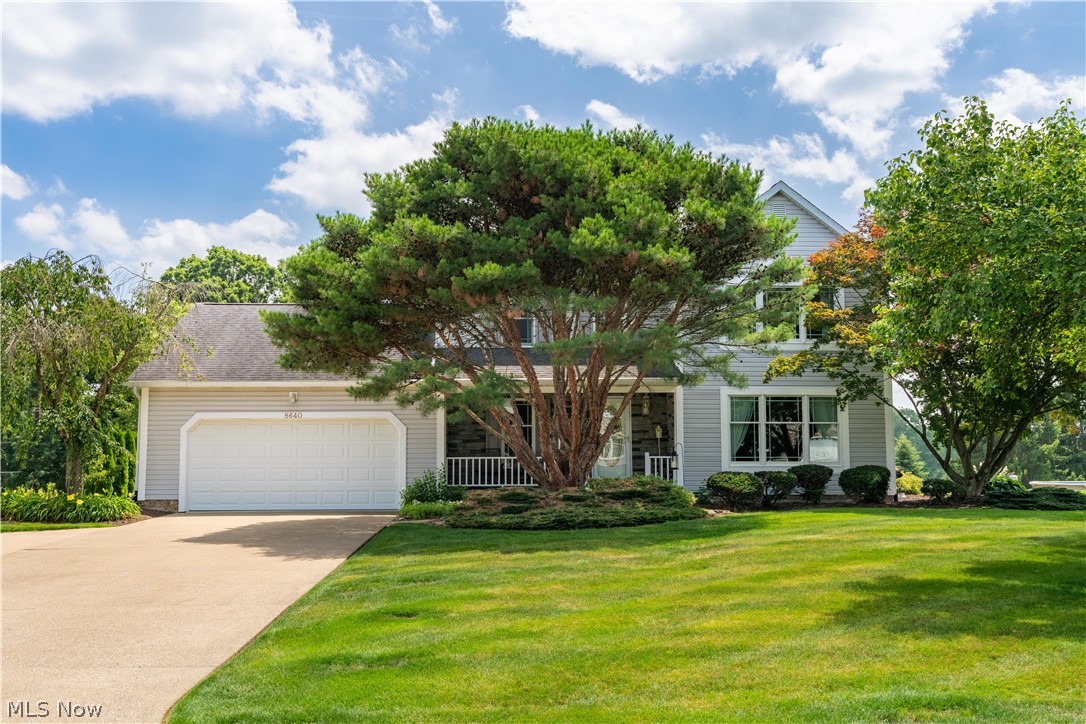 Beautifully updated and truly move-in ready, this exceptional home is nestled on a private lot in the Pines Hollow neighborhood, Jackson Township and offers nearly 3,000 finished square feet of living space with 4 bedrooms and 3.5 baths. A welcoming front porch leads into a bright foyer and spacious living room. The stunning eat-in kitchen is a chef's dream, featuring quartz countertops, glazed maple cabinetry with exceptional lighting, tile flooring and backsplash, newer stainless steel appliances and abundant storage. The kitchen opens to the inviting family room with a gas log fireplace and an impressive four-season sunroom with vaulted ceiling, walls of windows and sliding doors leading to the private backyard & patio. The first floor also includes a formal dining room, remodeled half bath and convenient laundry room. Upstairs, you'll find four generously sized bedrooms with ceiling fans and ample closet space. The spacious owner's suite features a vaulted ceiling, walk-in closet and a beautifully remodeled ensuite bath with custom tile shower, quartz vanity, tile floors and walls and a programmable towel warmer. The updated hall bath offers custom tile finishes and a large double quartz vanity. The finished lower level provides even more living space with a large recreation room, wet bar with full-size refrigerator and another updated full bath—perfect for entertaining or relaxing. Step outside to enjoy the private backyard featuring mature landscaping, gardens, patio, firepit area & a peaceful setting. The clean, heated garage offers epoxy flooring, extra storage and a new service door. Additional updates include newer Andersen windows, microwave & range (2025), refrigerator & dishwasher (2023), washer & dryer (2021), hot water tank (2020), 200-amp electrical service, a 14x10 storage shed & a new front storm door with retractable screen. This meticulously maintained home offers the perfect combination of comfort, quality and location. Simply move in and enjoy!