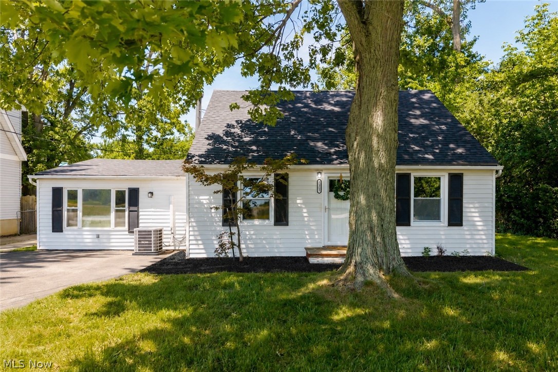Beautifully updated Cape Cod in Mentor's Woodside Acres subdivision offers 1,727 square feet of thoughtfully finished living space across two levels. This 3-bedroom, 1.1-bath home has been refreshed throughout, showcasing a bright, open living area, an eat-in kitchen with white cabinetry and stainless appliances, and a dedicated dining space that flows seamlessly for everyday living and entertaining. The main level features a convenient bedroom, full bath, and laundry, while the upper level hosts two additional bedrooms and a stunningly updated full bath complete with double vanity and soaking tub. Insulated windows, forced air gas heat, and central air keep the home comfortable year-round, while vinyl siding and a BRAND NEW roof provide lasting curb appeal and easy living. Set on a generous 0.41-acre lot with a deep, lush yard and mature trees, this property delivers the outdoor space buyers crave — all within the highly regarded Mentor Exempted Village School District. A detached 2-car garage with asphalt drive rounds out the package with ample storage and parking. Whether you're a first-time buyer or looking to right-size without compromise, this move-in-ready Cape Cod checks every box — schedule your showing today.