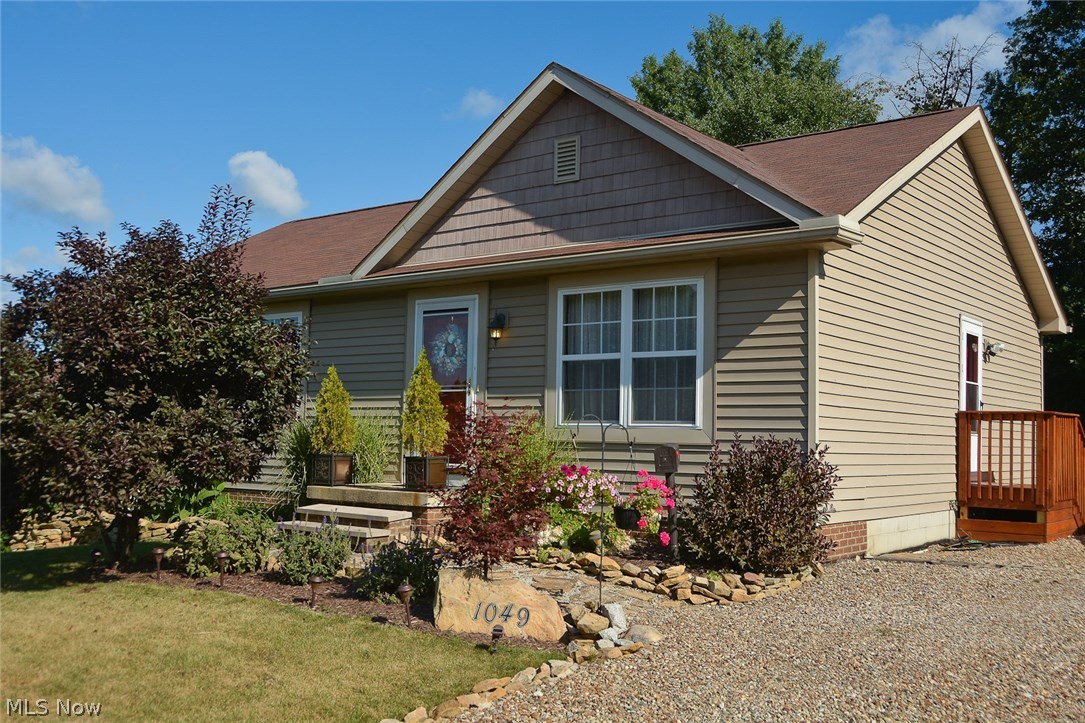 This adorable home was built in 2004 and is move-in ready! It sits on an extra-large lot on a dead end street. A block foundation w/footer is present for a future garage. There are 3 bedrooms and 2 full baths! This home offers a fully appl kitchen with oak cabinets, above cabinet rope lighting w/power outlets, a center island, and wood floors! This open floor plan has vaulted ceilings in the great room (wired with in-wall wire and speakers for 5.1 Surround Sound), the  dining area, and the kitchen. There are sliding glass doors to a beautiful 12'x12' deck with steps leading to the private back yard. The master bedroom has  recently been painted and is updated with laminate flooring, and there is a ceiling fan and full bath! The 2nd bedroom has been updated with paint, wall covering on one wall, and a ceiling fan. The lower level has a 12 course basement which has been fully insulated in the block, and is just waiting for the buyer's personal touch! Storm doors were added in 2014, with