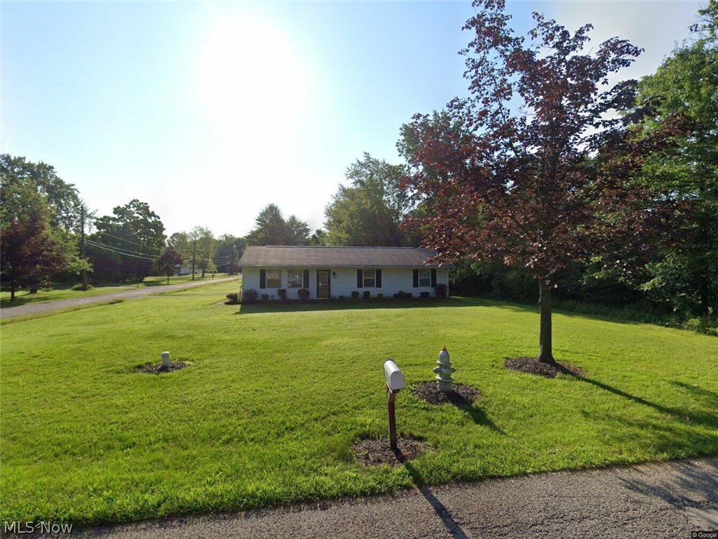Welcome to this all one level Ranch styled home, great location and beautiful yard, it has a newer kitchen and is ready for your touch. The home is an open floorplan that flows. The kitchen is a spacious gally style that is open on both ends, one to the utility / laundry that has access to the 2 car garage. The other to the large dinning area that is also open the great room. Down the hall you will see the full bathroom and 2 well sized guest rooms at the end is the primary bed room with it's own half bath and nice size closet.