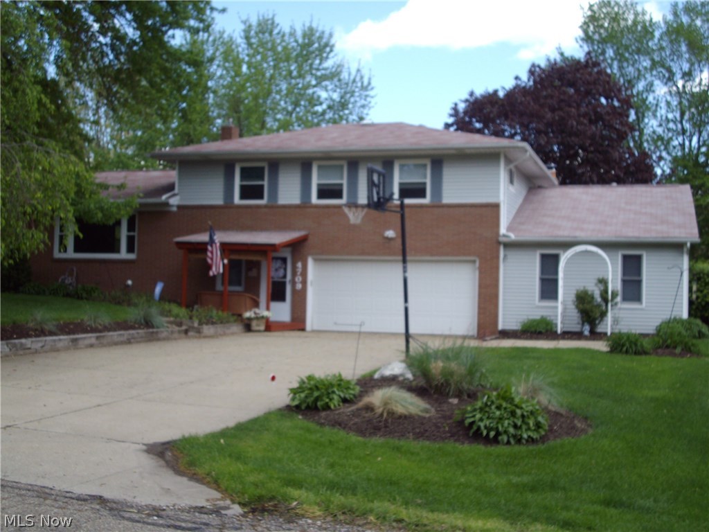 This home is a wonderful place to call home with tons of High  End updated features that provide a safe haven for your family 3 bedrooms and 2.5 baths in the main home and offers a In-Law Suite with its own kitchen , living room area and bedroom with full bath built in 1999 or use as a 1st floor Master, Suite has a lovely deck for relaxing pleasure .  The home sets on a lovely lush lot in Green and is in a friendly neighborhood minutes from Akron and Canton Interstate. theaters and great restaurants. The Master Bedroom has its own full shower bath, another full bath on the upper floor with double sinks and a half bath located conveniently on the main level . The eat-in kitchen offers Corrine counter tops, Oak cabinets, a slider into the enclosed sun room, a slider to the large back yard and a convenient office on the first floor . The large family room offers plenty of room for friends and family to relax and is accessible to the additional suite, a large brick wood burning fireplace a