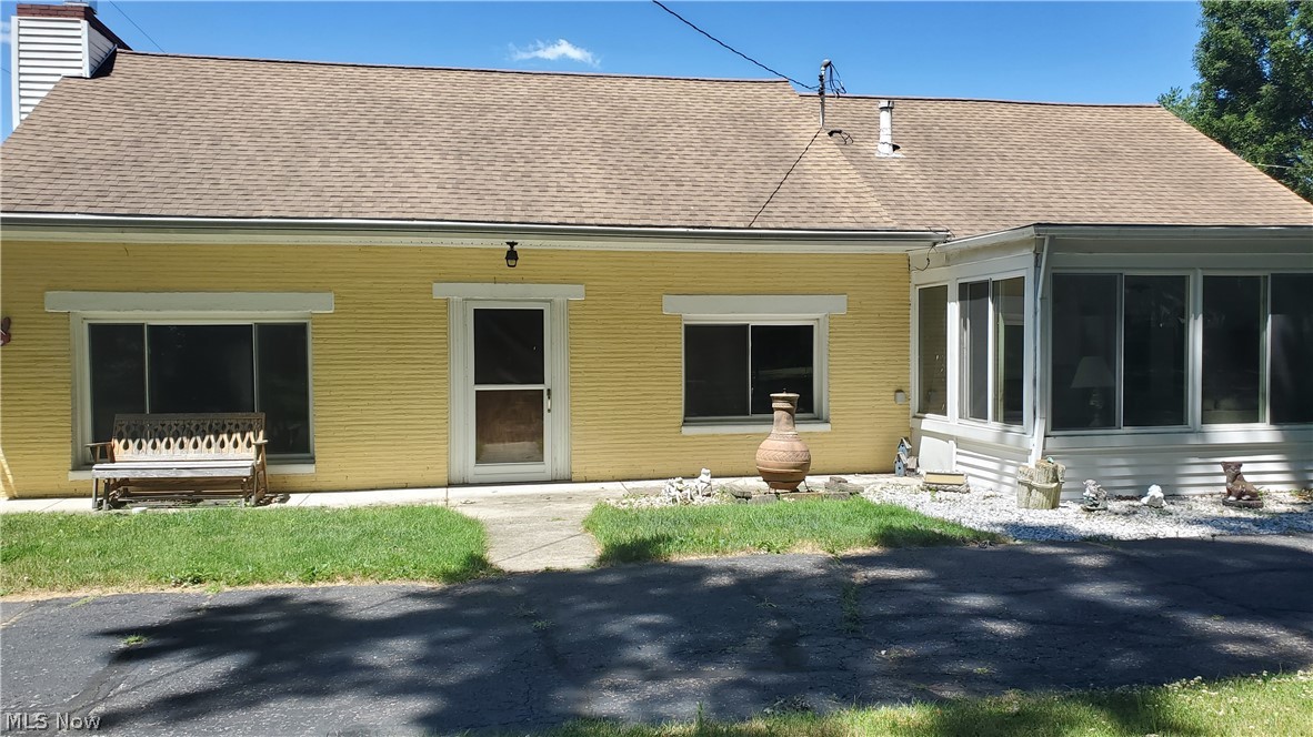 Looking for privacy in the heart of Elyria? This property is a half acre treasure! Three bedrooms, two baths with master bedroom on the main floor as well as utility room. The four season room overlooks the front yard with plenty of trees for privacy. The second level has kitchen area, bedroom, and full bath. Two view this unique home CALL for a personal tour!
