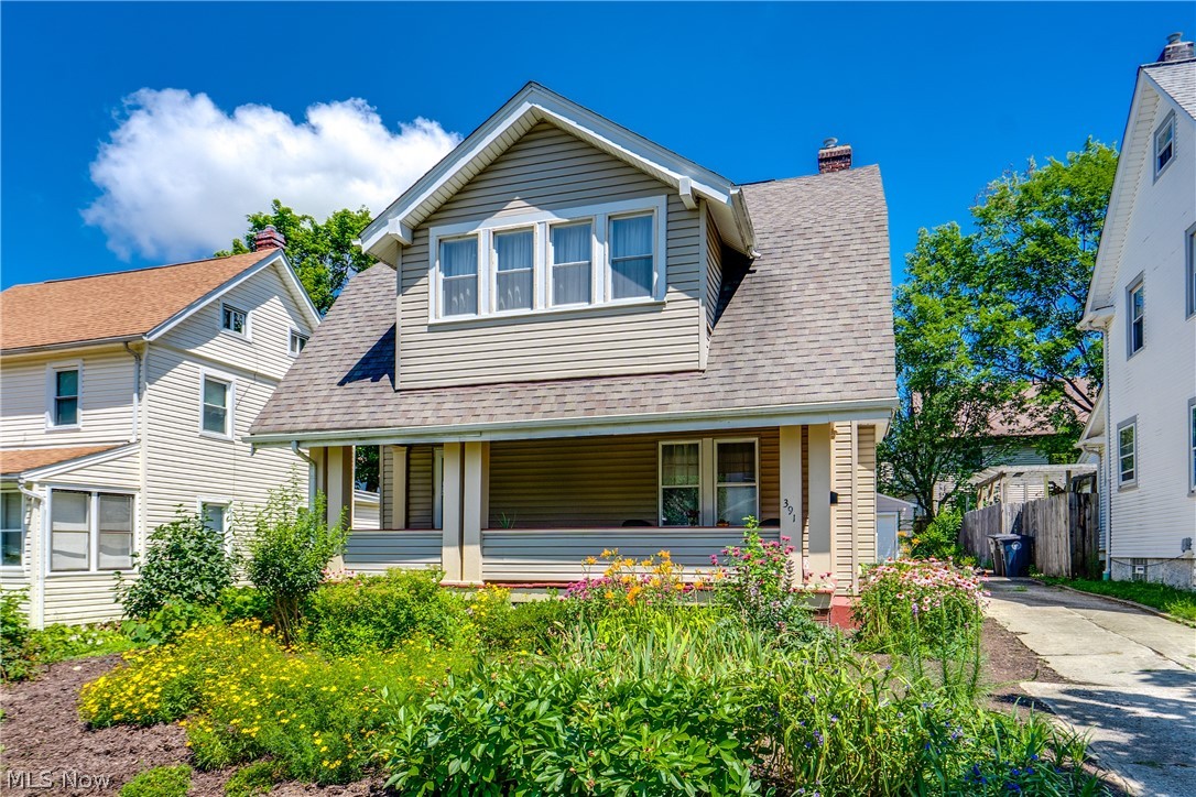 Welcome to this charming Craftsman Bungalow in the heart of desirable Firestone Park. Offering 3 bedrooms, 1 full bath, and 1,485 square feet of living space, this beautifully maintained home also features a finished third-floor flex space ideal for a playroom, craft room, home office, fitness area, or abundant storage. From the moment you arrive, you'll be welcomed by the inviting full-length freshly painted front porch overlooking vibrant perennial gardens, creating the perfect place to relax with your morning coffee or unwind at the end of the day. Inside you’ll find rich original woodwork, built-ins, and staircase, showcasing craftsmanship and the timeless character rarely found in today's homes. Gorgeous original hardwood floors grace the staircase and second-floor bedrooms, while two bedrooms feature charming original built-in dressers that add both character and functionality. The updated full bath blends modern convenience with classic style, and the spacious kitchen offers abundant cabinetry and workspace. Just off two of the upstairs bedrooms, the enclosed sunroom provides a bright and versatile retreat ideal for reading, working from home, or simply enjoying the changing seasons. Step outside to your own peaceful backyard oasis where a paver patio overlooks beautifully established pollinator gardens filled with coneflowers, milkweed, blazing star, yarrow, sage, acanthus, and a blackberry bush, creating a natural sanctuary that attracts butterflies and birds throughout the season. An oversized detached one-car garage provides additional storage and workspace. Recent improvements include glass block basement windows and added attic and basement insulation (2022), a new chimney liner and cap (2024), and new attic windows (2026). Combining historic charm, quality craftsmanship, modern updates, and beautiful outdoor spaces, this exceptional Craftsman Bungalow offers a rare opportunity to own a truly special home in one of Akron's most beloved neighborhoods.