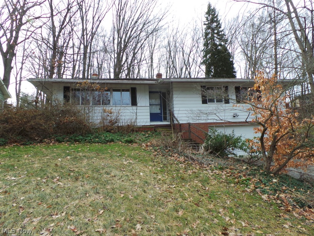 Three bedroom raised ranch with attached two car garage.  Large family room with FP.  Spacious living room and kitchen on main floor.  Property needs work.  Sold AS IS.