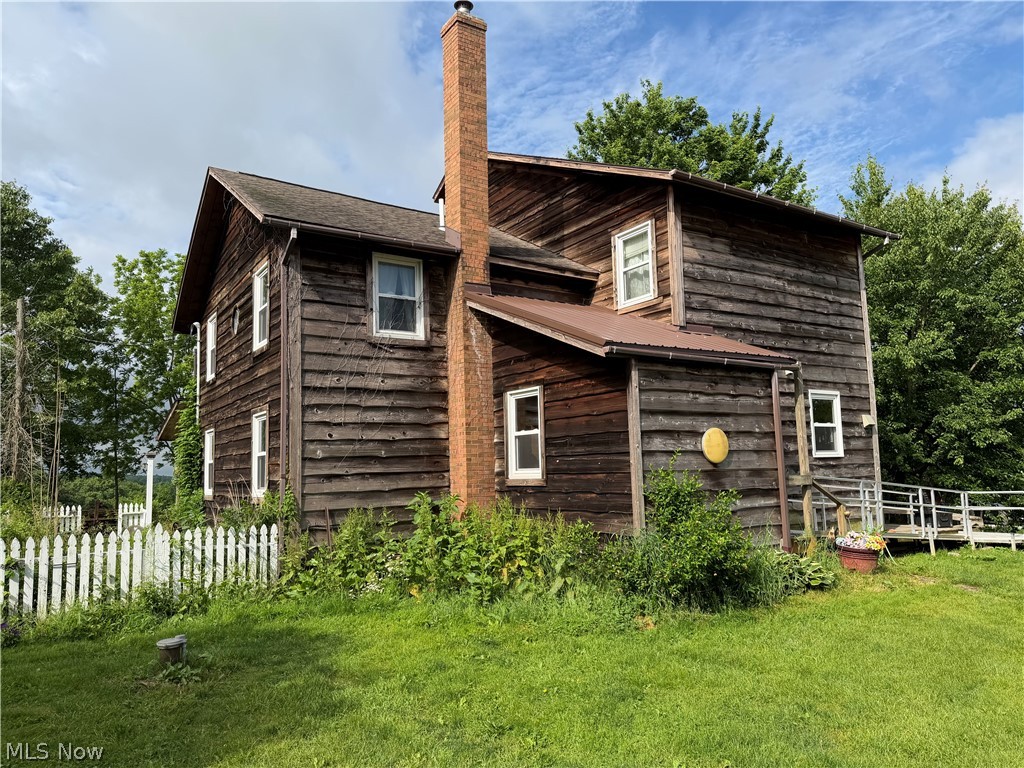 Ford Trust Live Real Estate Auction ~ Wednesday Evening August 12th 2026 @ 6:00 P.M. 
2 Story Home ~ Buildings ~ 47 Acres~ Carroll County ~ East Township ~ Carrollton EVSD
Good 2 story home of approx. 1800 sq. ft. built in 1982. First floor includes a carpeted living room with half bath, sunken carpeted family room, carpeted dining area, kitchen with built-in cabinets, tile countertops, and linoleum flooring, along with a laundry/pantry area and mudroom with linoleum floors. Second floor features two carpeted bedrooms and a full bath. Third floor is finished and carpeted bedroom. Vinyl replacement windows throughout. Shingle roof and wood siding.  Open wood deck at the rear and a covered side porch. Approximately ¾ basement with stone and cement block foundation, cement floor, breaker box electric, Brunko wood burner add-on, newer gas forced-air furnace, central air, and newer gas hot water tank. Outbuildings include a 30' x 50' pole barn with metal siding and roof, sliding doors, water and electric, workshop area, and cement floor. A 32' x 44' pole garage with wood siding and metal roof. Well and septic system. All Situated on 47.8 acres of land with 1200+ ft. of frontage along SR 9, including pasture, hay ground, and around 30 acres of wooded land. Gas/Oil rights not included.