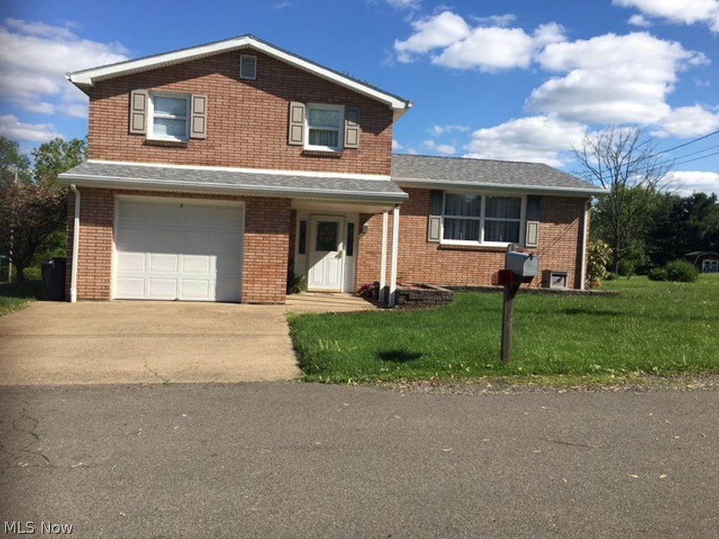 Follansbee- This split level all brick home features 3 bedrooms, 1.5 baths, formal dining room, family room and a large eat-in kitchen. Home is located on a very large flat lot.  A great home for entertaining. Covered back patio is a great spot for relaxing and enjoying the beautiful wooded area. Pristine condition. Don't wait to view.