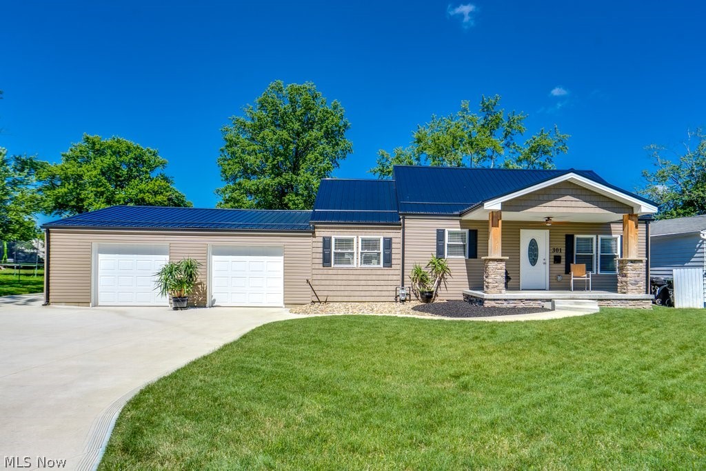 This beautifully renovated home has been completely updated from top to bottom with quality craftsmanship and premium finishes throughout. Exterior improvements include a durable 50-year metal roof, new siding, spouting, leaf guards, a new concrete driveway with custom trowel work, an inviting front porch, a back patio, and a sidewalk. The property is fully enclosed by a commercial-grade vinyl fence with a locking gate and includes a new 10' x 16' storage shed.

Inside, the home has been rebuilt with new drywall throughout, spray-foam insulation in the ceilings, and closed-cell spray-foam insulation in the basement for exceptional energy efficiency. All electrical and plumbing systems have been replaced from the street inward, along with new electrical service, lighting, and fixtures throughout the home. Comfort is ensured year-round with a new high-efficiency HVAC system and all-new ductwork, while an on-demand Navien water heater provides an endless supply of hot water.

The interior showcases Lifeproof luxury vinyl plank flooring throughout the main living areas, with new carpet in the upstairs bedroom. Custom-built Fedor cabinetry enhances both the kitchen and bathroom vanities, complemented by granite countertops and solid hardwood trim throughout the home.  The kitchen is equipped with a full suite of Samsung Smart Wi-Fi appliances, including a double-oven gas range with air fryer, refrigerator, dishwasher, and microwave. Additional modern features include digital faucets in the kitchen and bathrooms, Low-E Argon windows with faux wood white blinds, and high-efficiency LED lighting throughout.

The attached garage has a new mini-split system for heating and cooling with an option for gas heat, new garage doors and openers, an electric fireplace, and durable high-density carpet squares designed to withstand vehicle traffic. A GE Profile high-efficiency smart washer and dryer are included, along with an additional washer/dryer hookup in the basement.