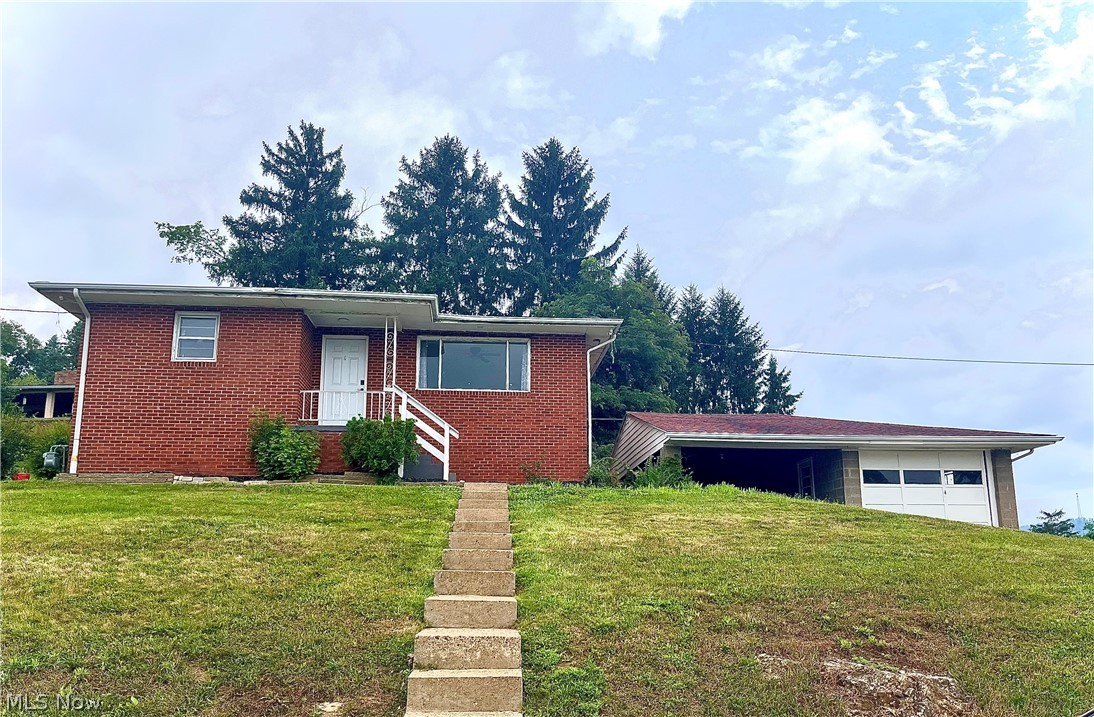 Renovated, roomy, and ready for you - Step into this beautifully updated 3-bedroom, 2-bath brick home that combines comfort, charm, and ample living space. Inside, you'll enjoy a spacious layout with a partially finished basement that offers flexibility for storage, recreation, or future expansion. Situated in town and just a short distance from the Scenic Ohio River, this home provides everyday convenience with a touch of natural beauty. For those needing additional parking or storage, a detached one-car garage is also included - giving you even more opportunity to make this property your own
