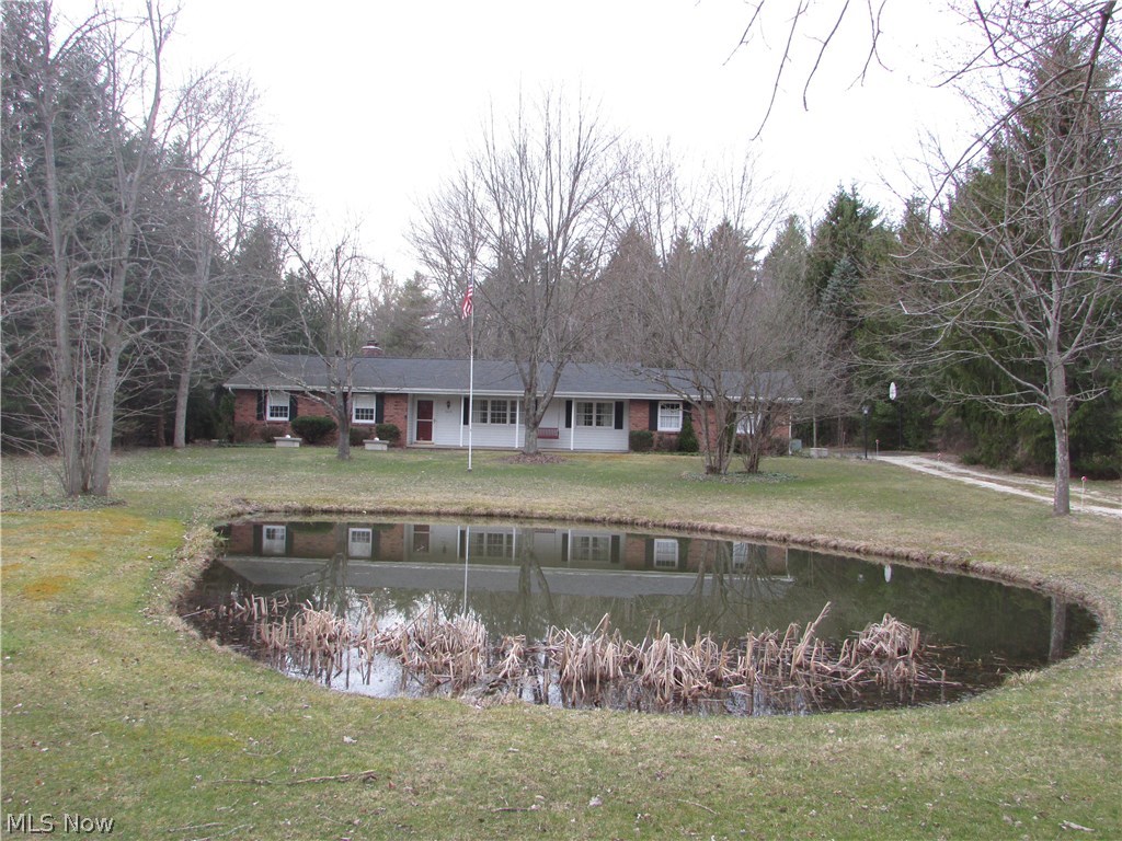 A true Richfield gem, this 3 bedroom 2.5 bath ranch sits on 1 1/4 acres of private land.  The scenic lot has a pond in the front and is wooded to the rear.  There is a wood burning fireplace in the family room that opens to a sun porch.  The formal living room and dining room overlook the pond.  There is a master suite that looks out into the wooded rear yard.  There is an attached 2 car garage, new cistern, updated electric, and so much more.