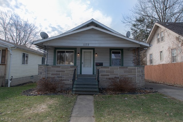 Why rent when you could buy this cozy, move-in ready home!  Features include; a covered front porch, hardwood floors in the living room, dining room and a great sized kitchen.  Appliances included are range, refrigerator and microwave.  The dining room features built-ins for extra storage.  2 Bedrooms and a full size bathroom complete the main floor.  The partially finished basement has enough room for a recreation room, office and/or another bedroom.  The unfinished portion of the basement has plenty of storage along with a shower, sink and toilet! The backyard is fully fenced!  Call to schedule a showing today!
