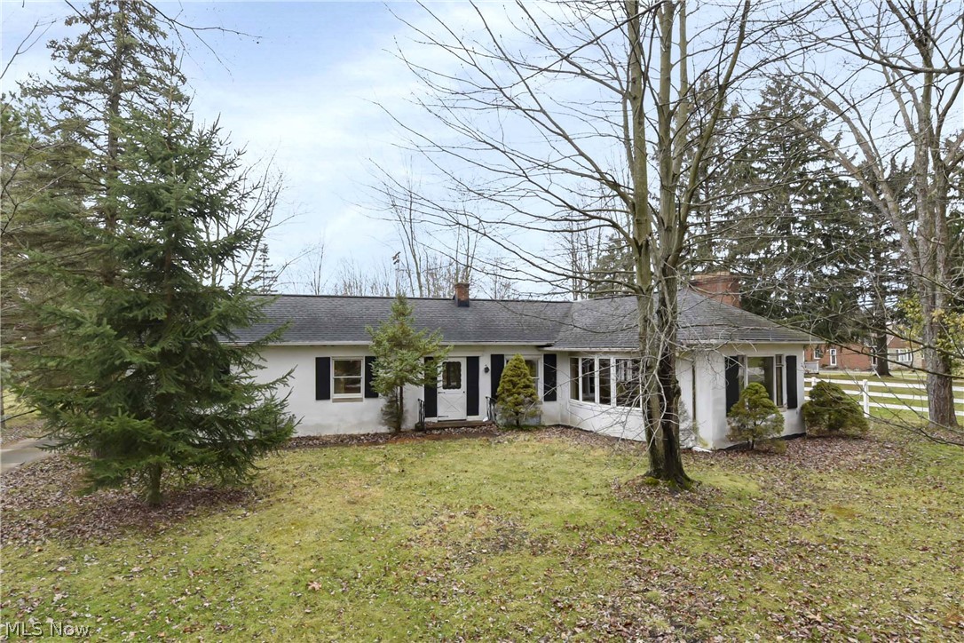 Prepared to be Moved!....by a rare opportunity to own this 4 bed 2 bath home on 10.74 acres with a 3-car heated garage and an airplane hangar/runway all packaged up in one pretty BIG package located in the sought after suburb of Broadview Heights!! The 2500+ Sq Ft. house features original hardwood floors throughout, coved ceilings, two fireplaces, a dining room, eat in kitchen, dedicated office/study space, a four season room with newer indoor/outdoor carpet, and a finished basement. Closet, built-in, and storage space galore for all your treasured belongings. The huge garage with recently updated roof is really a car aficionado's dream with plenty of space to tinker while staying nice and warm all winter long. House roof is around 10 years old. This solid house has tons of potential! Call today for your private tour and make it shine once again like the precious gem it is!
