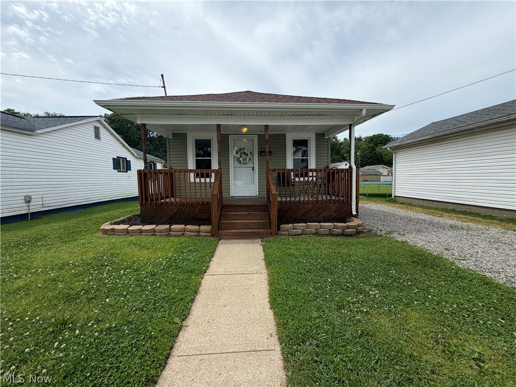 Cute, updated, and all on one level! This charming 2-bedroom, 1-bath home offers an open-concept living room and kitchen, first-floor laundry hookups, and easy access to the side patio overlooking a beautiful flat backyard—perfect for a swing set, pets, or entertaining. Enjoy quiet mornings on the cozy front porch, all while being conveniently located near many north end amenities.
