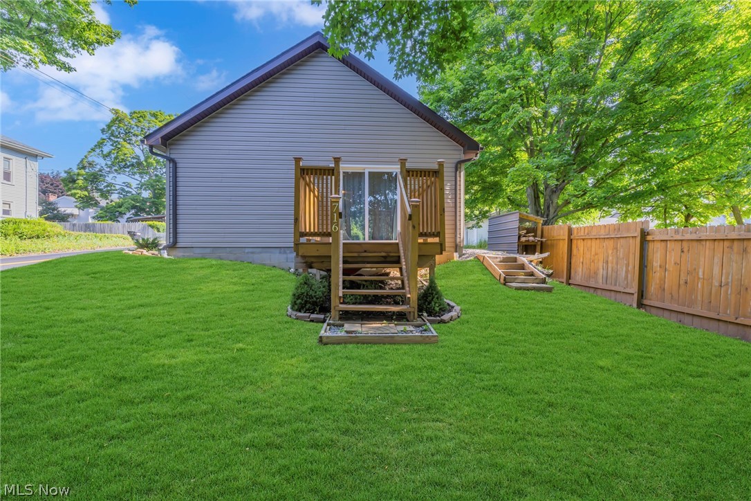 This 2021-built ranch sits at the back of its lot, with a beautiful canopy of trees shading the front yard and a flat, open yard that offers plenty of room for play, gardening, or relaxing outdoors. Inside, the home feels fresh and modern. The kitchen features an eat-at island, perfect for casual meals or gathering with friends, and comes complete with all appliances staying for a seamless move-in experience. The bright living room is anchored by French doors that lead directly to a small porch, creating a charming spot for morning coffee or evening relaxation. Two comfortable bedrooms and a full bathroom complete the thoughtful layout, offering just the right amount of space for easy, single-level living. Parking is a breeze with a one-spot carport plus an additional off-street parking space, and rear alley access adds extra convenience. Step outside to the porch and enjoy the tree-framed setting—whether it's a quiet moment with a book or unwinding at the end of the day, this home offers a comfortable and convenient lifestyle.