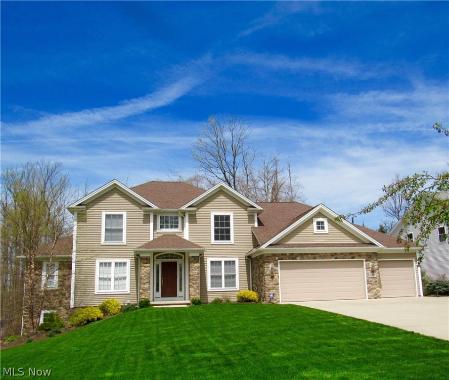 Gorgeous first floor master open floor plan. The minute you walk into this home you will fall in love. The wood floor 2 story foyer welcomes you into the home. To the left of the foyer is the study with glass french doors- then to the right of the foyer is the formal dining with a trey ceiling also with  wood floors. The 2 story great room is the focal point of this home! The great room has volume windows which  over looks the spectral backyard, the corner gas fireplaces add to the charm of the room. The great room flows into the pillars kitchen with maple cabinets, granite counter tops, white subway tile backsplash. Gourmet cooking can be done w/ the gas stainless range plus there is a walk in pantry closet.The first floor master has a walk in closet with California organizers - the master bath has a corner garden tub and a tiled shower. The stairs leading to the upstairs is open and has wrought iron spindles. Once your upstairs there is a loft and 3 more bedrooms. The children bath has double sinks and ceramic tile floor. The lower level is a walk out with a rec room, office that could be a fifth bedroom and another full bath. There also is a workout room- the glass door in the rec room leads out to a 15x30 inground pool with a large stamped patio with 2 private sitting areas. The pool and yard area has a wrought iron fence surrounding it. The backyard backs u to the nature preserve. This makes this yard one of the most private backyards! Call to see this home today.