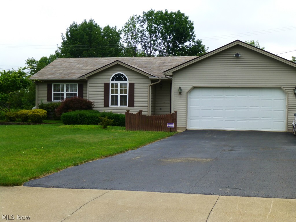 Columbiana - spacious 3 bedroom, 3 bath ranch located in the desirable Cimarron development.  The entry way opens to a bright and cheery living room which features a vaulted ceiling, ceiling fan and gas fireplace.  The eat in kitchen offers a 10 x 11 dining area, access to the 2 car attached garage, and the convenience of a first floor laundry closet!  The master bedroom offers a master bath, separate vanity area, and a walk in closet.  Two sets of french doors open to a rear deck which overlook a vinyl fenced in yard featuring a small pond and shed.  There is plenty of storage space available in the basement which has one finished room and a bath.  The possibilities are endless, this one won't last long!