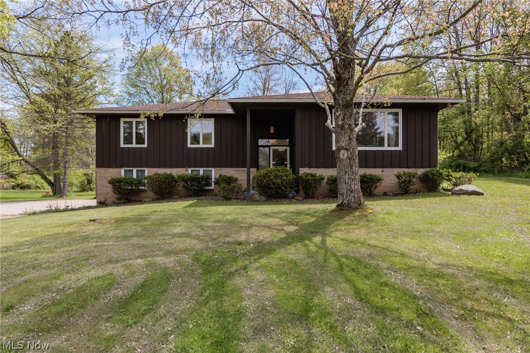 Wow!!  Entertain all summer long at this custom built 3 bedroom 2 1/2 bath home that sits on 2.4 acres and has a back yard oasis.  The 34x16 heated (new 2024) concrete pool  is large enough for many guests, as well as the 52x19 covered area in case that is needed.  The rear deck also has a hot tub.  The spacious home has a huge sunken great room, formal dining, a large eat in kitchen (with it's own staircase from the lower level), and 3 nice sized bedrooms on the main level.  The master suite is 16x14 with an updated bath.  The lower level contains a huge family room with a fireplace, and a 19x16 recreation room.  The electric panels were replaced in 2021, hot water tank 2020, water softener 2022, and gutters 2021,   There is a large outbuilding, playhouse, attached 2 car garage, and so much more.