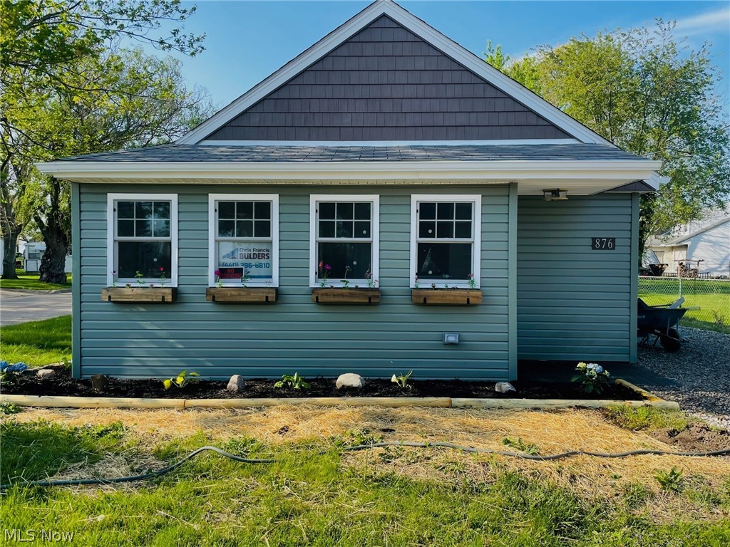 This 2 bedroom cottage is located in desirable Bluebird beach with peek-a-boo views of Lake Erie. Bluebird Beach has a beautiful private association beach. This cottage has been updated from siding, windows, new kitchen, light fixtures, opened to a stunning open concept, extra sleeping loft for kids or extra guest(or storage), majority of drywall, insulation, driveway ,paint & so much more. This custom rehab by a hometown builder shows craftsmanship & pride. Walking distance to historical downtown Vermilion. Whether you make this your summer home or year round, you won't be disappointed. The work is done for you. Lot is permitted for a garage already. Seller can build or pass permit to buyer. Don't miss out on this  cottage! Call/text agent for showing.