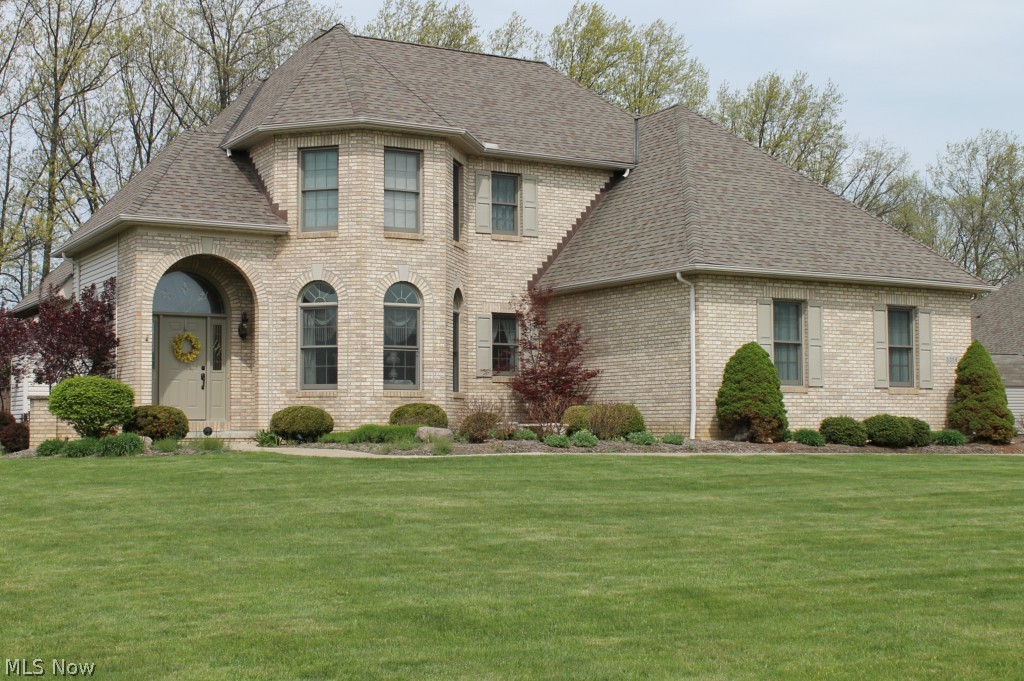 Quality Bennett Built Home!  Beautiful Brick front home situated on a cul-de-sac lot with treed back yard and NO rear neighbors!  Master bedroom is on the first floor with a master bath dual sinks and huge walk-in closet.  Large Kitchen boasts of cherry custom hard wood cabinets, granite counter tops and tile back splash.  There are two breakfast bars with morning room.  Great room has a brick gas log fireplace.  Dining room with hardwood floors.  First floor laundry room.  Two bedrooms upstairs are attached with a jack and jill full bathroom.  All interior doors are 36" wide.  Exterior is professionally landscaped and maintained.  Sprinkler system, up lighting on landscaping and down lighting on composite rear deck.  Move in, relax and enjoy!