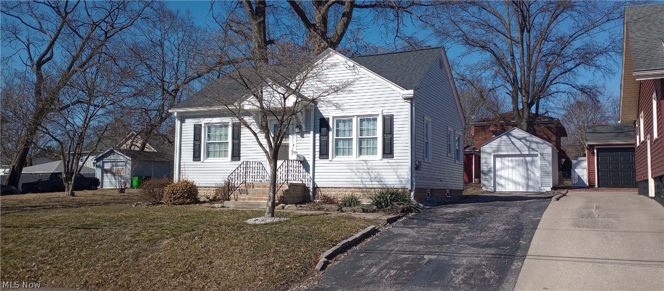 Attractive 2-3 bedroom ranch with an extra lot. This clean move-in ready home is one you don't want to miss! Sunny windows and neutral decor throughout. Smoke and pet free home, Updates include brand new vinyl siding and flooring, newer A/C unit, hot water heater and roof. Main floor features an eat-in kitchen, living room, full bath and 2 bedrooms. Downstairs you'll find a fantastic 12 X 122 rec room, convenient 3rd bedroom, 1/2 bath and large storage/laundry area. Back patio and lovely backyard are perfect for entertaining! Quiet neighborhood close to shopping, hospital, restaurants and Portage lakes.