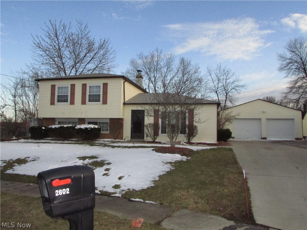 A remarkable 3 bedroom split level in Stow.  This home features a 26x24 2 car garage that can fit all of your needs, and there is also a shed.  The yard is completely fenced, and has a patio.  The large living room is open to the remodeled kitchen.  A 20x14 Family room is in the walk out lower level.  The bedrooms are spacious.  This home has many updates, and also features a metal roof.