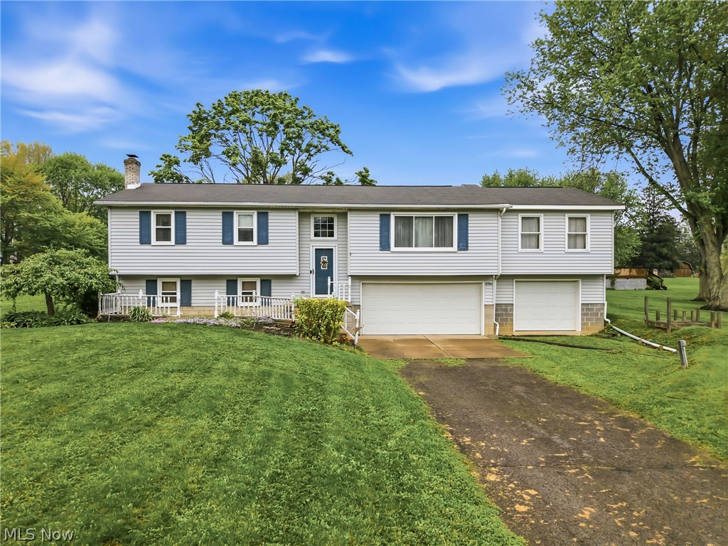 Welcome to this beautiful Bi-level home in the desirable Apple Valley Acres neighborhood in Leetonia, OH. Situated on exactly 1 acre, this well-maintained residence features 4 bedrooms and 2 full baths, offering 1,616 square feet of above-grade living space, plus an additional 528 square feet of finished space in the lower level. This total does not include the unfinished second primary suite, which provides the opportunity to create a 5th bedroom and 3rd full bath, offering great potential. The main level features a spacious living room highlighted by a large bay window that fills the space with natural light. Just off the living room is a bright dining area with direct access to the back deck, overlooking the expansive backyard. Adjacent is the kitchen, equipped with stainless steel appliances and ample storage space. Also on the main level is the primary suite featuring a stand-in shower, along with two additional well-appointed bedrooms that share a full bathroom. An addition completed in 2003 expanded the main level to include a second primary suite designed for an en suite bath and walk-in closet, with electrical work already completed. In the lower level, you will find a large rec room featuring a wood-burning Franklin stove, the 4th bedroom, ample storage space, and the laundry/utility room. This level also provides direct access to the 3-car garage, with the third bay added in 2003 as part of the addition. The well pump was replaced in 2020. Don’t miss your chance to own this beautiful home and property in Apple Valley Acres, located in the Crestview LSD!