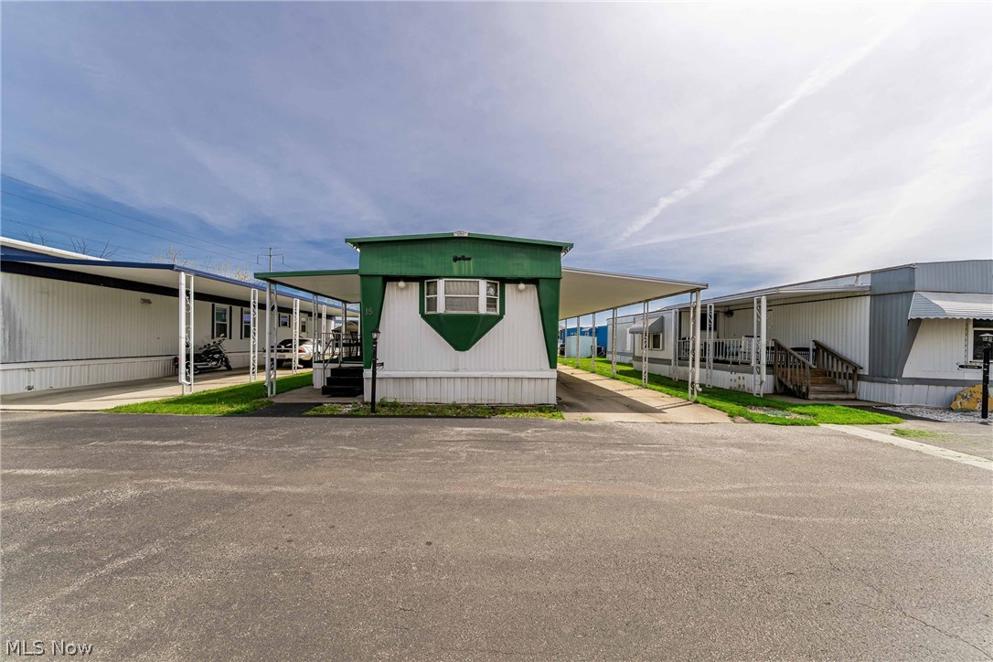 Mobile home hunters, your search is over!! Welcome to this irresistible Parma Estates trailer!! Nestled in a cozy corridor of the highly-coveted Parma Estates Mobile Homes community (a premier 55+ area), this incredibly-maintained, classic, Victorian double-wide trailer boasts three beautiful bedrooms, two bodacious bathrooms, and a kaleidoscope of fabulous features. You’ll be captivated by the open floor plan that showcases a luscious living room, a captivating kitchen, and so much more.  With a covered carport, a spectacular shed, a stunning sitting area / porch, new AC (2025), new heat pump (2025), new furnace (2025), newer hot water tank (2023), a roof still under warranty for 15 years (done in 2016), and the comfort that comes from knowing this gem only had two owners, there’s only one thing left to ask: When are you coming “home”?