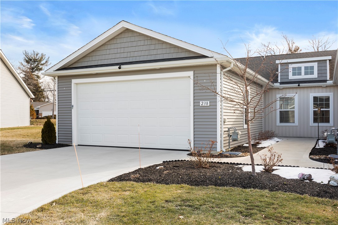 Well maintained and beautifully upgraded, this 2022-built END UNIT ranch home is one of only two with an expanded sunroom in the desirable Landings at Ridgewater community! The sunroom fills the home with natural light and offers peaceful morning sunrises.
Step inside to a thoughtfully designed, efficient layout featuring an upgraded kitchen with white shaker cabinets, quartz countertops, and an open dining area that flows seamlessly into the great room. The great room boasts a vaulted ceiling and a three-panel patio door, creating a bright and airy living space. The primary bedroom suite includes a private full bath and walk-in closet, while both bathrooms showcase upgraded vanities and countertops. All closets are enhanced with upgraded wood shelving and storage systems. All appliances remain, and the laundry room features added upper cabinet storage for convenience. Additional highlights include a pull-down staircase in the garage for attic storage, an EV charger for your electric vehicle, and an expanded paver patio perfect for outdoor enjoyment. Beautiful landscaping and a tree-lined homesite provide a sense of privacy, all on a low-traffic street on the western edge of town. Why wait to build? Move in and enjoy everything this exceptional home has to offer!