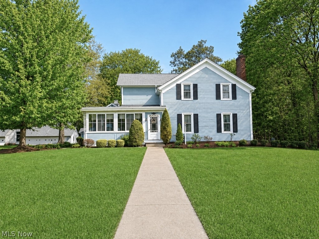 This beautifully maintained century home is the home everyone has always admired; the one people slow down to look at, the one that's always stood out. Now, it's finally within reach! With outstanding curb appeal, this property, set on 2.64 acres, blends timeless character with modern comfort. Featuring six bedrooms and two baths, the main level includes two versatile bedrooms currently used as an office and TV room, along with a full bath and convenient first-floor laundry. The tastefully remodeled kitchen, boasting granite countertops and engineered hardwood flooring, provides the perfect amount of space to cook all your favorite meals. Adjacent to the kitchen is an intimate dining room with a bay window, ideal for holiday gatherings. The cozy living room showcases a stunning chestnut fireplace mantle that rests above an airtight fireplace insert, while the spacious family room offers a built-in wet bar- ideal for entertaining or creating the ultimate game room. A window-lined enclosed porch provides a peaceful place to take in the surrounding views. Upstairs features four additional bedrooms, including a generously sized master bedroom and a full bath with a soaking tub. As if the home itself doesn't make you swoon, prepare to be blown away by the exterior amenities the property has to offer. A large heated 2200 sq ft six-car garage, that doubles as a workshop, is a car enthusiast or handyman's dream come true. Love to entertain? You will be mesmerized by the stunning pavilion featuring a wood-burning fireplace and stereo system, an incredible space for hosting gatherings in any season. Complete with a wooden deck, patio and outbuilding/garden shed, this property is a true private oasis. With its timeless charm, inviting spaces, and thoughtful details throughout, this home blends beauty and comfort in a way that just feels right the moment you step inside. It's more than a place to live; it's the home you've always imagined calling your own.