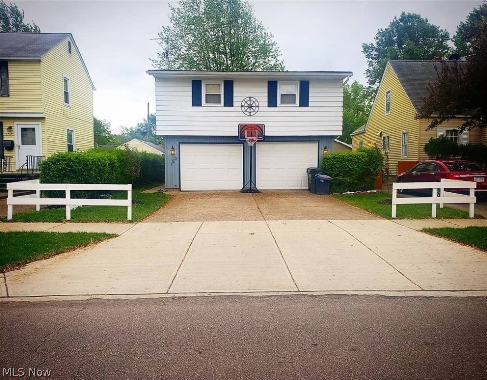 Custom-built updated & spacious multi-level home in a desirable area of Elyria.  Large open floor plan, 4 bedrooms, 2 full baths, attached 2-car garage, finished basement w/ rec room, enclosed back sun porch overlooking the fenced back yard.  This one of a kind home ha received many improvements include a complete kitchen expansion & remodel project with granite sink, more storage and additional counters & cabinets.  New flooring, original hardwoods, new wiring, freshly painted, gutter guard, foyer entry, and you will also notice the extra wide hallways and steps in this home.  Newer roof, windows, furnace and central air. The home can be considered a 'smart home' with its smart key pad, garage door opener & Nest.  When the seller moved in, they had a sump pump back-up system installed, along with new exterior drain lines, as preventative measures.  Tons of additional storage in the attic and garage shelving.  This home is perfect for relaxing and entertaining both inside and out.  Con