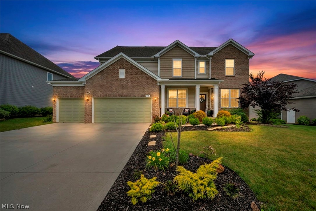 (4K Video Available) Exceptional opportunity w/fast occupancy available in highly sought-after Preserve at Miller's Farm! Surrounded by mature trees/located within award-winning Revere Schools, beautifully upgraded home offers over 3,100 sq. ft. of thoughtfully designed living space w/4 bedrooms, 3 full baths (potential for a 5th first-floor bedroom or guest suite with an adjacent full bath). Attractive upgraded elevation combines brick & shake siding w/welcoming front porch, rare 4-car garage includes EV charging station & offers potential for additional living or hobby space. Relax or entertain on the spacious new patio overlooking the beautiful yard. Inside, soaring ceilings, walls of windows plus open-concept design create a bright, inviting atmosphere. Impressive family room flows seamlessly into the gourmet kitchen featuring granite countertops, massive center island w/breakfast bar, wall oven, 5-burner gas cooktop, abundant cabinetry & oversized walk-in pantry. Versatile flex room is ideal as a formal dining or living room, while the unique planning/homework center & first-floor office add everyday convenience. Luxurious owner's suite features three large windows, spa-inspired bath w/tiled shower, separate vanities plus spacious walk-in closet. Three additional oversized bedrooms, a loft perfect for a media room, upgraded full bath w/quartz vanity & convenient second-floor laundry complete upper level. Full basement w/drywalled ceiling offers endless possibilities for future finishing or storage. Additional upgrades include premium trim/interior doors, reverse osmosis system, Wi-Fi-enabled sprinkler system & access to outstanding neighborhood amenities. Beautifully designed, loaded w/upgrades & priced to sell, this is a rare opportunity to own an exceptional home just minutes from shopping, dining & major highways.