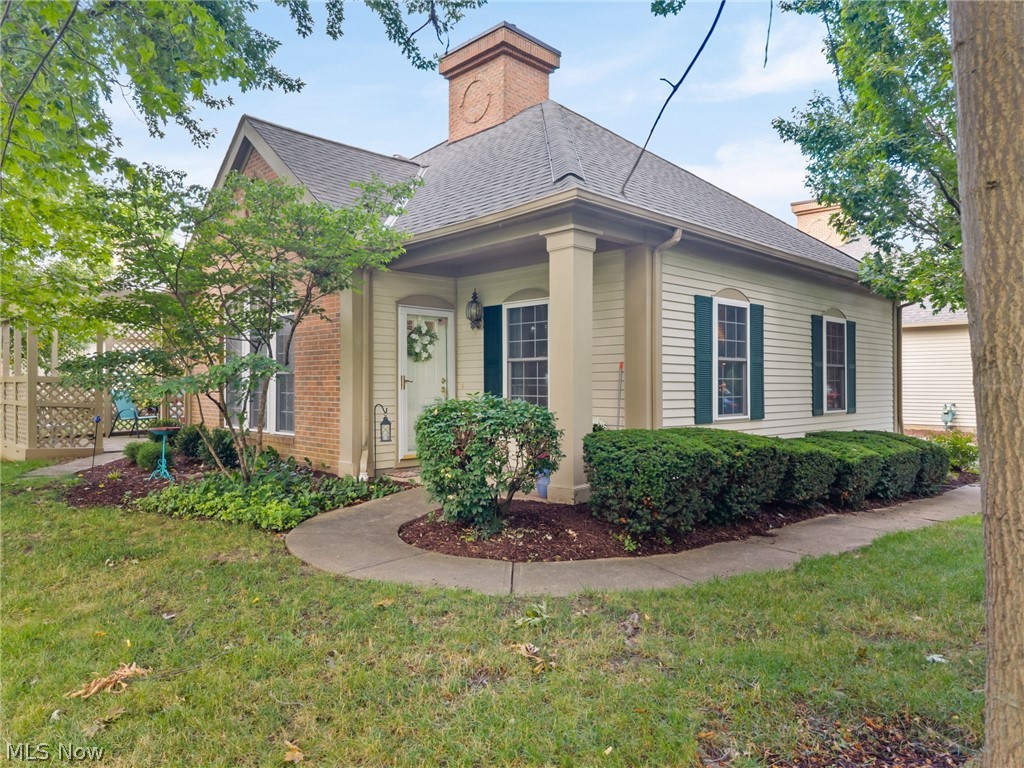 Tucked among the trees with the soothing sound of a water fountain nearby, lies a beautifully updated condo that offers private & spacious living! This striking unit offers one-floor living but also has a versatile 2nd floor loft with a skylight & half bath that can be used as a guest room, home office or hobby room. As you enter the unit, vaulted ceilings & abundant natural light combine to create a bright, inviting living & dining space with an impressive sense of openness. Gorgeous engineered hardwood flooring graces most of the main level & a gas fireplace will give you the warm & cozy ambiance that the colder months demand. The dining room has a glass slider with access to a private patio & a breakfast bar in the kitchen offers more casual dining. The kitchen is stunning with lots of white cabinetry, some with glass doors, quartz countertops, tile backsplash & stainless steel appliances. Between the kitchen & the garage you'll find a laundry room with a utility sink, more cabinetry & a washer & dryer that stay. The primary bedroom has double closets & an en suite bath with walk-in shower & great lighting. There is a tub in the main bath & all bathrooms have ceramic tile flooring. The second bedroom is currently being used as an office/den but has built in storage & armoire. Ample closet space throughout, including a walk-in storage room on the 2nd floor, allows better storage space than you'll find in most condos. The attached garage is safe & convenient with more parking available right outside the unit. There's almost nothing that hasn't been updated in the past 10 years including a a roof in 2017, furnace & C/A in 2016 & refrigerator in 2024.  A one year home warranty is also being included for a buyer's peace of mind.