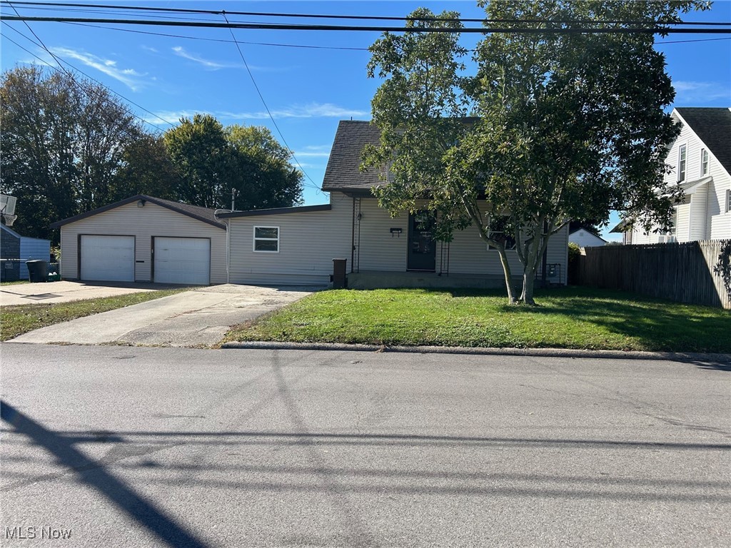 Charming Move-In Ready Home on a Double Lot! This spacious 4-bedroom, 1-bath home sits on a beautiful double lot featuring a large, flat backyard—perfect for outdoor activities. The yard is enclosed with chain-link fencing and includes a spacious back deck, covered front porch, and plenty of off-street parking. An oversized 2-car garage provides ample room for vehicles, storage, or hobbies. Inside, you’ll find a bright and inviting living room with engineered hardwood flooring. The kitchen offers an abundance of cabinetry and opens to a generous dining area with direct access to the back deck and garage—ideal for entertaining. A large first-floor laundry room adds convenience, along with two main-level bedrooms and a beautifully remodeled full bath. Upstairs, you’ll find two additional bedrooms, one featuring an oversized walk-in closet, plus an extra area perfect for an office, playroom, or reading nook. Updates include a roof less than 2 years old, new furnace (2025), new water heater, new flooring throughout, and a completely remodeled bathroom. Conveniently located near the city park, schools, and all amenities.