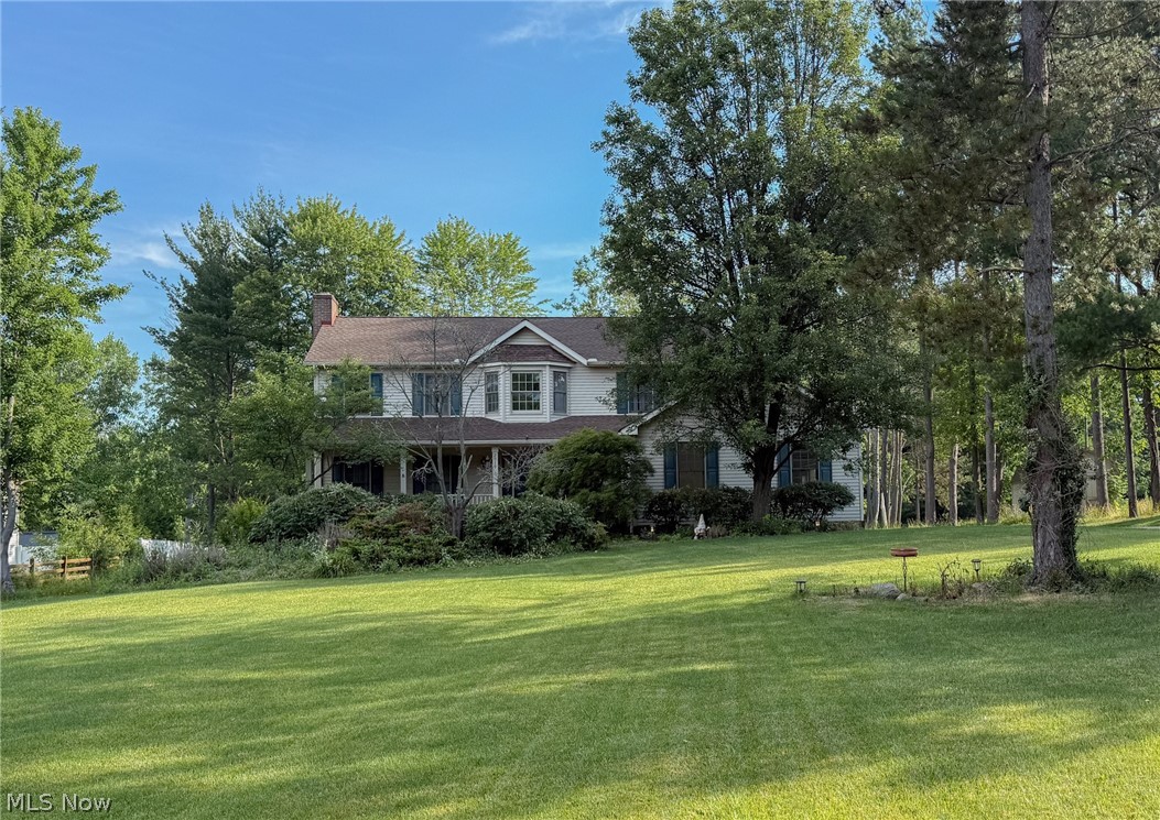 Welcome to this beautiful home located in the highly desirable Twinsburg School District! Situated on a picturesque wooded lot with pond access, this property offers the perfect blend of privacy and comfort. The inviting main level features a spacious sunken family room with a gas fireplace that flows seamlessly into the large eat-in kitchen, complete with stainless steel appliances, ample counter space, and a generous pantry. Adjacent to the kitchen, the formal dining room showcases an elegant tray ceiling and has been updated with new flooring, which continues into the living room. Fresh interior paint throughout adds a bright, modern touch.

A convenient first-floor laundry room and half bath complete the main level. The finished basement offers plenty of additional living space, perfect for a rec room, media room, or home gym. Upstairs, you'll find four generously sized bedrooms. The fourth bedroom features French doors leading to the primary suite, making it an ideal office, nursery, or sitting room. The spacious primary bath includes double sinks, a soaking tub, and separate shower, while the hall bath also offers double sinks and a separate shower area for added convenience.

Step outside to enjoy the private deck overlooking the serene wooded backyard, creating a peaceful setting for relaxing or entertaining. Don't miss this wonderful opportunity to own a home in a fantastic location with access to nature right outside your door!

Roof (2015), Hot Water Tank (2026), AC (2021), New Flooring in Dining and Living Rooms, and Fresh Interior Paint, New Landscaping Lights