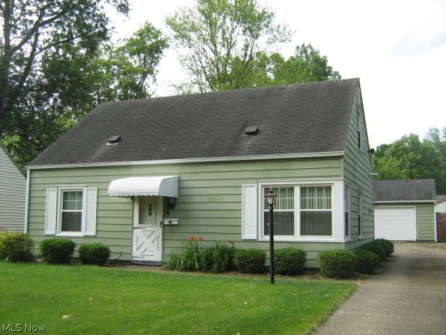 Affordable Cape Cod features 3 good-sized bedrooms plus a den/office with built-in bookshelf wall!  Excellent closet and storage space.  Lighted ceiling fans.  All appliances included and Baldwin piano can stay!  Enjoy summer on the brick patio.  Partially fenced backyard.  Nice level lot.         2 1/2 car garage has add-on offering many possibilities.