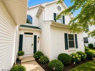 Welcome to this impeccably maintained second-floor condominium, offering an exceptional blend of comfort, style, and convenience. Ideally situated near I-480 and Great Northern Mall, this residence provides easy access to premier shopping, dining, and major commuting routes. This spacious condominium features 2 generously sized bedrooms, 2 full bathrooms, and the convenience of in-unit laundry. Soaring ceilings enhance the open-concept design, creating a bright and inviting atmosphere throughout the home. The updated kitchen seamlessly connects to the formal dining area, providing an ideal setting for both everyday living and entertaining. The expansive primary suite offers a large walk-in closet and a private en-suite bath complete with dual vanities and a tub/shower combination. The elegant great room is highlighted by a cozy gas fireplace and direct access to a private balcony, perfect for relaxing and enjoying peaceful outdoor space. Additional amenities include an attached two car garage and ample storage space within the laundry area. This move-in-ready condominium offers low-maintenance living in a highly desirable location, combining modern convenience with timeless appeal.
